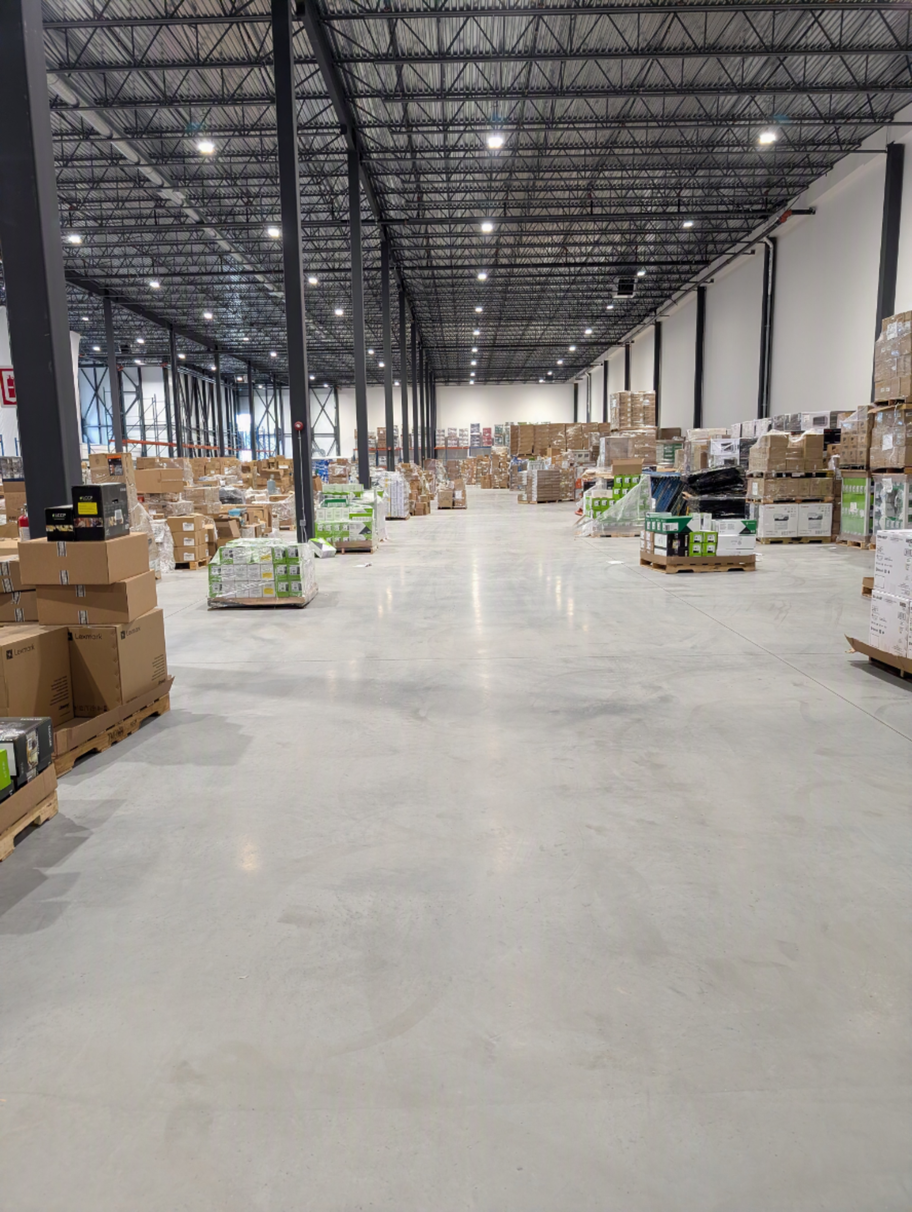 Warehouse aisle with pallets of inventory